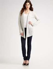 Ultra-soft cashmere shapes the body with and angular hem and bell sleeves. Dry clean or hand wash Imported