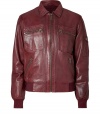 Lend an eye-catching edge to your slick outerwear favorites with McQ Alexander McQueens super soft oxblood lambskin jacket - Pointed collar, long sleeves, ribbed knit cuffs and hemline, zippered front, zippered front slit and patch pockets, zippered pocket on sleeve - Classic blouson silhouette - Wear with edgy knitwear, jeans and leather boots