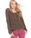 In a stylishly slouchy shape, this Free People cable-knit sweater is a hot layering piece for fall!