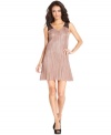 A sheer lace back adds eye-catching appeal to this pleated BCBGeneration dress -- perfect for hot soiree style!