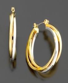 Classic hoops with a twist: these large hoops earrings from Lauren Ralph Lauren feature intertwined silvertone and goldtone hoops for an overall chic effect. Diameter measures 1 inch.