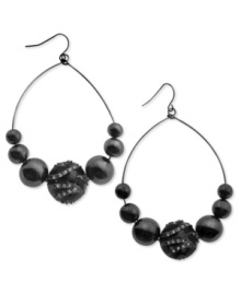 GUESS is having a ball with this set of fish-hook drop earrings. Crafted from hematite tone mixed metal, the earrings feature glass stones for added luster. Approximate drop: 1//2 inch. Approximate diameter: 2 inches.