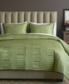 Luxe texture meets a serene green hue in this Key West quilt from Bryan Keith for a calming oasis in the bedroom. Lush quilted details form an uneven stripe design with pops of muted color interspersed.