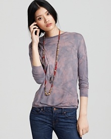 A splashy tie-dye print of supple silk jersey lends a bohemian edge to this Generation Love long-sleeve top.