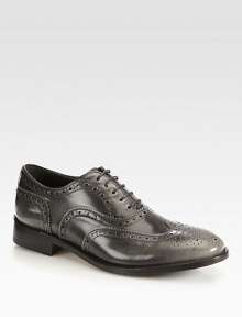 A traditional wingtip and perforated details top this burnished leather favorite with a subtle hint of sheen. Stacked heel, 1¼ (30mm)Leather upperLeather liningLeather and rubber solePadded insoleMade in Italy