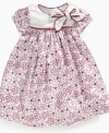 Your beautiful little buttercup will love the fun flowers on her dress from First Impressions.