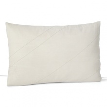 An earthy, simply detailed pillow with stitched lines over a fine mesh netting.