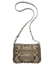 Snake-embossed leather makes this exclusive crossbody purse by Calvin Klein a stellar style option. Remove the strap to carry it as a clutch.