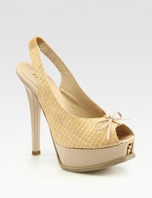 Grounded by a skinny heel and logo-embedded platform, this textured straw style features a slingback and dainty bow. Self-covered heel, 5 (125mm)Island platform, 1½ (40mm)Compares to a 3½ heel (90mm)Straw upperLeather lining and solePadded insoleMade in ItalyOUR FIT MODEL RECOMMENDS ordering one half size up as this style runs small. 