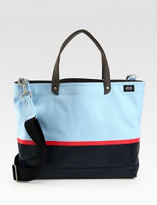 Tote your belongings around town in style this season with this structured canvas bag, dipped in rubber latex for added protection, in contrasting colors that lends a nautical feel to a contemporary design.Double top handlesAdjustable shoulder strapInterior zip pocketCanvas14W x 16H x 6DImported