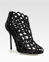 A suede heel lifts this modern cage silhouette of fine satin coated in light-catching Swarovski crystals. Suede-covered heel, 4¼ (110mm)Satin upper with Swarovski crystalsPeep toeBack zipLeather lining and solePadded insoleMade in Italy