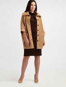 From its oversized collar to its finely ribbed texture, this knit cocoon coat is bound to make an amazing first impression. Channel an old Hollywood look and pair it with a pencil skirt.Oversized collarThree-quarter sleevesButton closureSlash pocketsAbout 33 from shoulder to hemWoolDry cleanMade in Italy