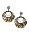 Add a little wild to your style with trendy animal prints. GUESS earrings feature cut-out leopard print circles highlighted by sparkling crystal posts. Crafted in silver tone mixed metal. Approximate drop: 2-3/4 inches. Approximate diameter: 2 inches.