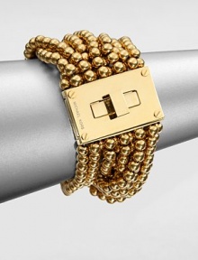 From the Modern Classics Collection. Bold and beautiful strands of polished beads with a glowing golden finish are connected to a striking turn-lock clasp in this sophisticated design.GoldtoneLength, about 7Width, about 1.75Turn-lock claspImported