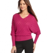 An allover waffle knit adds on-trend texture to this silk-blend Calvin Klein sweater -- perfect for cold-weather style!