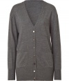 British style stalwart Paul Smith is renowned for his elegant, classic-with-a-twist aesthetic, and this grey wool cardigan is a prime example - Slim, straight cut hits below hips - Deep v-neck and long sleeves - Placket extends from chest to hem and features assorted decorative buttons - Two pockets at hips, single pocket at chest - Ideal for work or weekend and for pairing with cigarette trousers, skinny denim and pencil skirts