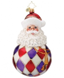 Santa Claus melds with a classic Christmas ball in this lovely hand-painted glass ornament from Christopher Radko to add some joy to your tree this holiday season.