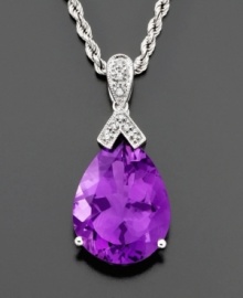 Add a touch of glamour to your neckline. A pear-shaped amethyst (13 ct. t.w.) shines brightly on an ornate diamond-accented 14k white gold bale. Rope chain measures 18 inches; drop measures 1-1/4 inch.