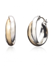 Snap up the hot, new trend of two tone jewelry with Monet's versatile twist hoops. Earrings feature an overlapping hoop design crafted in silver tone and gold tone mixed metal. Approximate diameter: 1 inch.