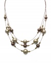 Simulated pearls and beads in a beautiful brown palette are symmetrically arranged in Charter Club's three-row illusion necklace. Crafted in gold tone mixed metal. Approximate length: 17 to 20 inches + 1-1/2-inch extender.