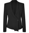 Detailed with a single textural metal button, Helmut Langs shawl collar jacket is an exquisitely edgy take on the brands iconic look - Shawl collar, long sleeves, structured shoulders, textured metal button closure, zippered side slit pockets, asymmetrical high-low hem - Loosely tailored fit - Wear with a draped tank, leather leggings, and platform heels