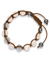 Spiritual-inspired bracelets are all the rage this season! Snap up this hot style from Ali Khan featuring semi-precious rose quartz beads and pave glass fireballs on a trendy brown cord. Bracelet adjusts to fit the wrist. Approximate diameter: 2 inches. Approximate length: 12-1/4 inches.