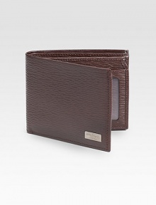 Stamped calfskin wallet with five credit card slots, two currency departments and one ID window. 4½W X 3½H Made in Italy