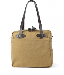 Stylish bag in fine cotton and leather - by US-label Filson, known for its luxurios and robust bags - casual tote shape (shopper) - classic camel color - tightly weaved cotton twill, water proof due to a special parafine wax coating - cowhide handles - intelligent and roomy interior, four outside pockets - functional top zipper - a favorite bag to have - genius for college, at the job, at leisure time