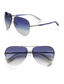 Favorite aviator design in a modern rimless style with logo engraved detail. Available in silver with blue gradient lens and brown demi shiny with brown gradient lens.UV400 lensTubular templeMade in Italy