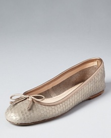 In a scaly metallic snake print, these embossed leather flats offer subtle yet exotic glamour. From Delman.