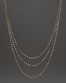 Delicate twisted chains of 14K white and yellow gold.