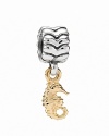 Dreaming of a destination vacation? PANDORA's sterling silver and 14K gold seahorse charm channels easy island living.