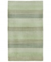 Hand-tufted, blended wool gives an exceptionally soft feel to this rug from the Coastal Treasures collection. In a shimmering, striped design of moss-green colorways, this sophisticated piece adds serene character to every decor.