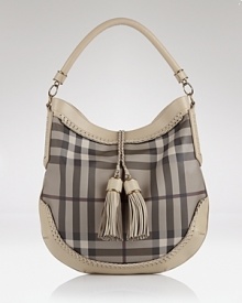 Let the British invade your closet in high style with Burberrry's check hobo. Shoulder the tassel-clad carryall to elevate daily looks--it loves crisp white blouses and loafer pumps.