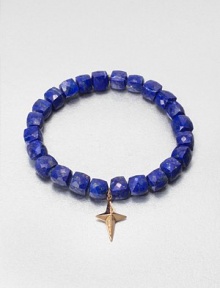 A sparkling diamond charm in 14k gold on a lapis stretch bead bracelet. Lapis14K goldDiamonds, .02 tcwLength, about 6.5Slip-on styleImported 