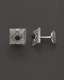 Intricate sterling silver cuff links, accented with black onyx. By Buccellati.