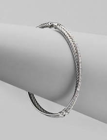 From the Silver Ice Crossover Collection. A twisted cable crisscrosses a diamond band in this graceful bangle of sterling silver and 14k white gold. Diamonds, 0.49 tcw Sterling silver and 14k white gold Diameter, about 2¼ Made in USA