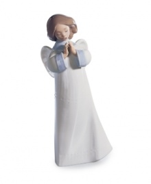 Fill your home with good spirits. With her hands together in prayer and mouth open in song, this Lladro angel figurine exudes quiet grace in handcrafted porcelain.