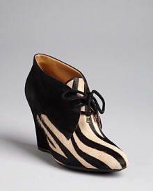 Isaac Mizrahi New York packs major exotic punch into abbreviated booties: Claw your way to the top of the fashion pack.