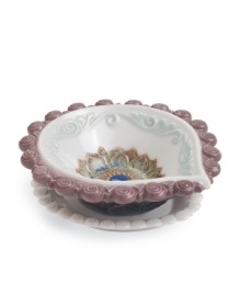 Decorate for Diwali, then enjoy the unparalleled grace of Lladro porcelain all year long with this handcrafted diya. With a colorful floral motif and swirls of purple and aqua.