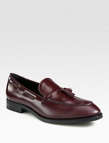 Front tassels and kiltie trim add moccasin inspiration to these glossy, Italian leather loafers. Leather upperLeather liningPadded insoleRubber soleMade in Italy