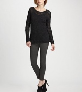 Dolman sleeves and a sleek boatneck complement wool-rich, semi-sheer crochet knit. Boatneck Long dolman sleeves Semi-sheer crochet Longer length hits below the hips 90% wool/10% nylon Dry clean Imported of Italian fabric