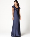 Eliza J's captivating satin cowl neck gown is a vision with its delicate lace details and fully buttoned back (which  cleverly disguises a more convenient zipper). You're sure to be stunning in this sweeping, royal wedding-inspired dress.