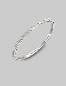 EXCLUSIVELY AT SAKS. A delicate design, offering two rows of small crystal solitaires with larger ones stationed along the slender bangle. Crystal Rhodium plated Diameter, about 2½ Hinged with push-lock clasp Imported Please note: Bracelets sold separately.