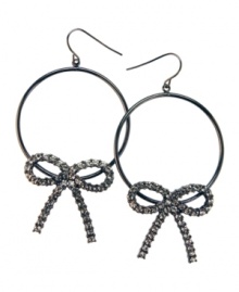 Sweeten up everyday hoops with this version by GUESS. Dark, hematite-plated hoops adorned with crystallized bows. Earrings crafted from mixed metal. Approximate drop: 2 inches.