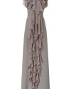 Prepare to turn heads in this dramatic, luxurious evening gown of pure silver-gray silk - Sleeveless, slim-fitted silhouette and deep back neckline - Ruffle trim cascades from short, round collar and flows down to floor-length hem - Features small train - Wear for a black tie event with platform heels and a clutch