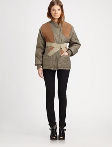 Channel the runway in this quilted coat with contrasting suede trim and a detachable corset panel for a dose of countryside-cool. Ribbed asymmetrical collarAsymmetrical zipperDetachable crossover panelLong sleevesRibbed cuffs and hemFully linedAbout 27 from shoulder to hemBody: 100% nylonTrim: Cotton/acrylic/suedeDry clean with leather specialistImportedModel shown is 5'10 (177cm) wearing US size 4. 