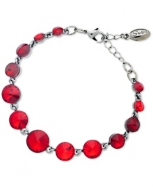 Look wondrous in red with this bracelet from GUESS. Crafted from hematite-tone mixed metal, the bracelet's red glass crystals lend a vibrant touch. Approximate length: 7-1/2 inches.