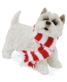 A fetching gift for animal lovers, the Westie Christmas ornament depicts the friendly white pup waiting patiently for treats and dressed in a holiday scarf. From Sandicast.