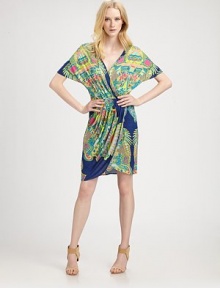 A vibrant print highlights this draped blouson style finished with soft pleats from hip to hem.V necklineDropped shouldersDolman sleevesBlouson bodiceElastic waistbandPleated mock-wrap skirtAbout 22 from natural waistRayonDry cleanMade in USA of imported fabricModel shown is 5'10½ (179cm) wearing US size Small.